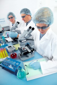 Group of medical doctors in laboratory. Scientific research.